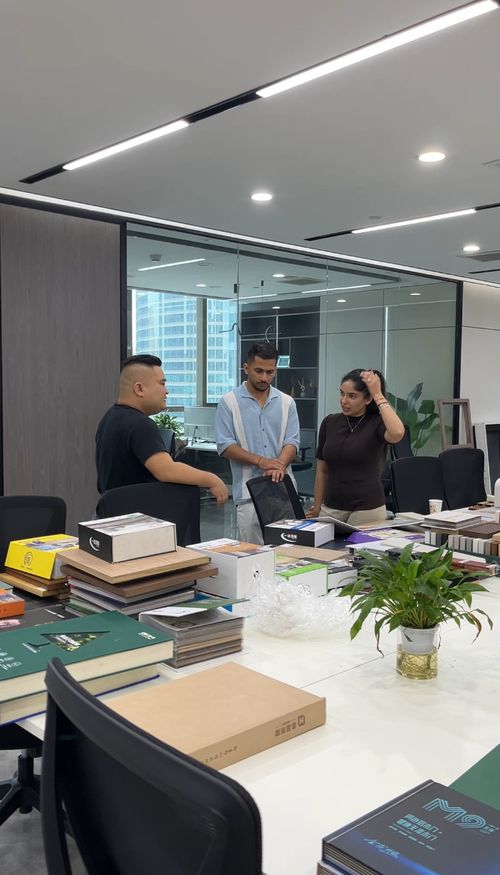 Relvano and overseas partner inspecting custom kitchen cabinet samples